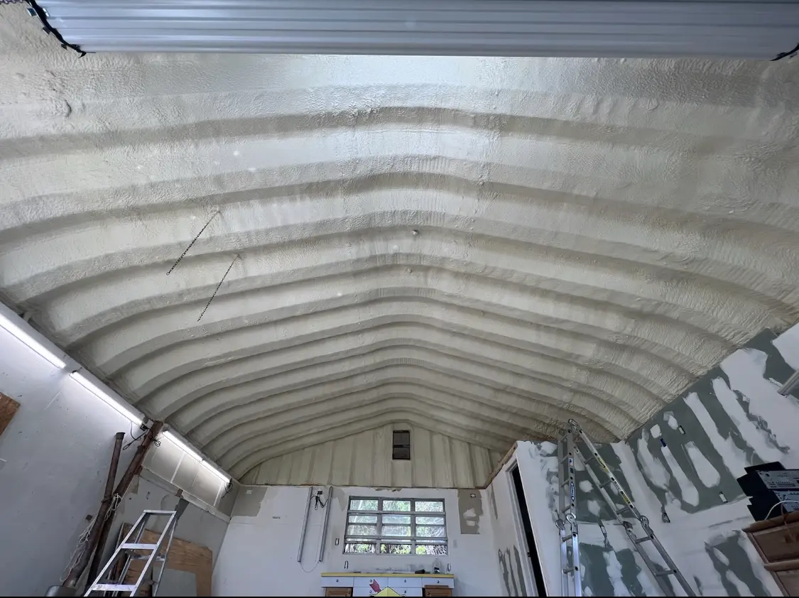 Spray polyurethane foam applied to the underside of a metal roof deck in Pleasant View